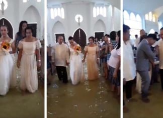 Una pareja camina al altar con la iglesia inundada